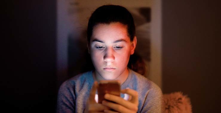 Student looking at phone