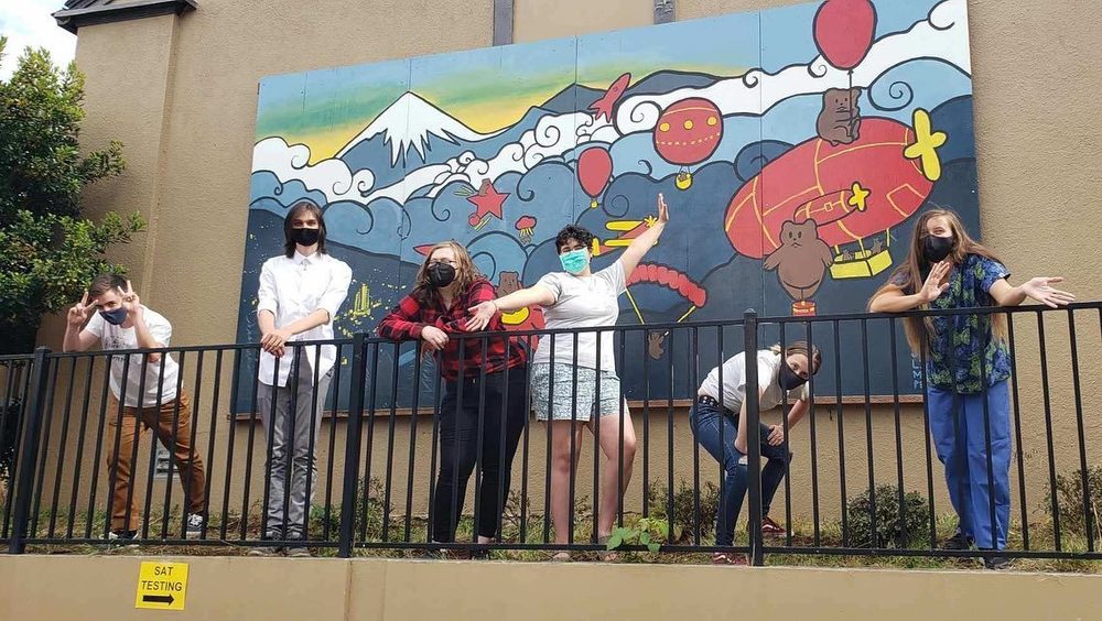 kids infront of mural