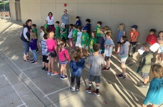 2nd grade gathering to solve the mystery of the missing wagons